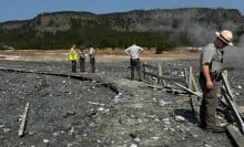 Park rangers assessing damage from the hydrothermal explosion in Yellowstone National Park.