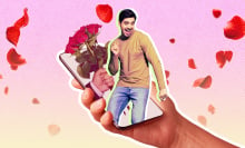 A man dancing on an iPhone surrounded by roses. 