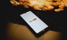 The Pornhub logo is being displayed on a smartphone screen