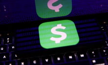 A phone screen displays a digital payment app logo and reflects back glowing blue lines of binary code. 