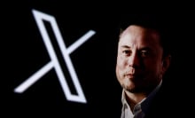 elon musk pictured with x logo behind him