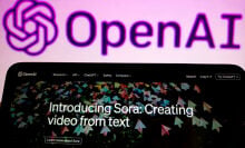 The Sora announcement on a smartphone in front of the OpenAI logo