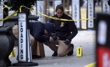 Police at the scene of Brian Thompson's murder.