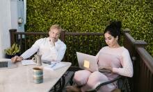 Two people sat with laptops