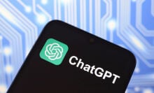 The ChatGPT logo appears on the screen of a smartphone