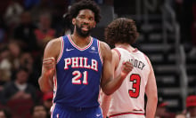 Joel Embiid #21 of the Philadelphia 76ers celebrates a basket against the Chicago Bulls during the second half at the United Center on December 08, 2024 in Chicago, Illinois