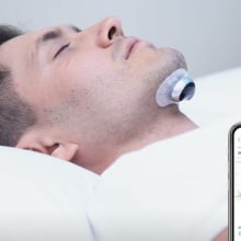 Person using the Snore Circle YA4200 Electronic Muscle Stimulator Plus.