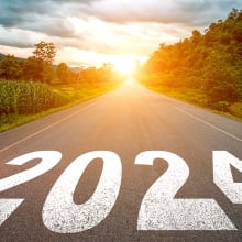 2024 written on a road heading towards the sun.