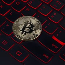 Bitcoin on a red backlit keyboard