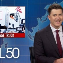 colin jost joking on SNL set with graphic about trump's gabage truck