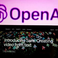 The Sora announcement on a smartphone in front of the OpenAI logo