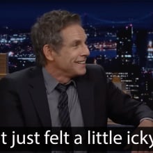 A man sits on a talk show couch, grinning. The caption at the bottom reads "It just felt a little icky."