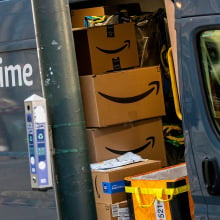 A view inside of an Amazon delivery truck filled with boxes.