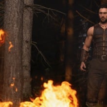 Aaron Taylor Johnson stands in fire in "Kraven the Hunter."