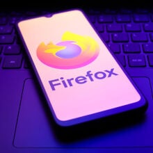 The Mozilla Firefox logo appears on the screen of a smartphone