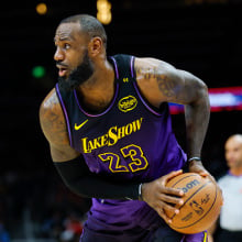 LeBron James #23 of the Los Angeles Lakers looks to pass during the second quarter against the Atlanta Hawks at State Farm Arena on December 6, 2024 in Atlanta, Georgia.