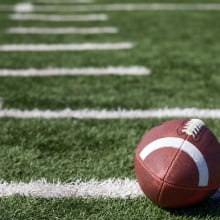 A football on a football field.