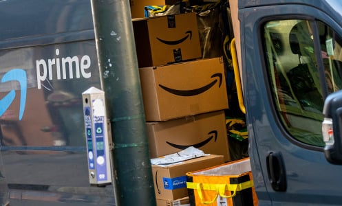 A view inside of an Amazon delivery truck filled with boxes.