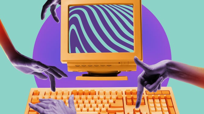 Human hands typing on vintage computer against mint background