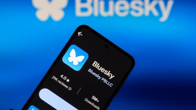 Blueksy logo on a smartphone and appearing in the background.