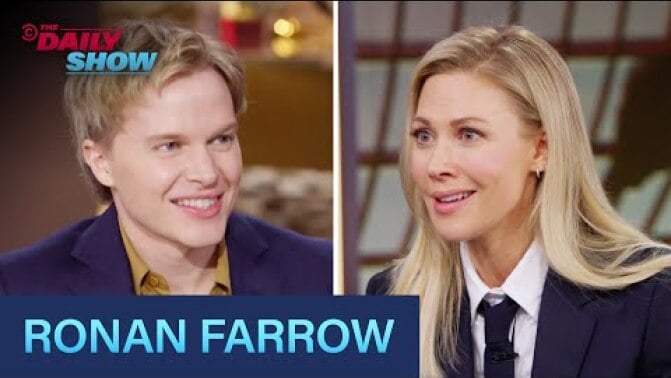 A side by side still of Ronan Farrow and Desi Lydic at the Daily Show news desk.