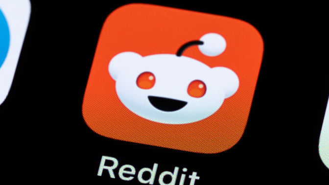 reddit logo on a black screen