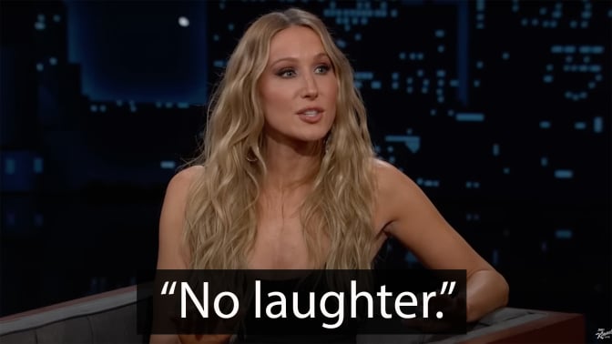 A woman sits in a talk show seat, grinning. The quote at the bottom reads, "No laughter".