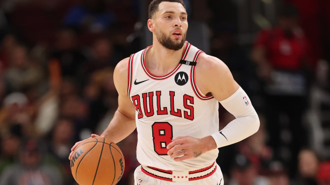 Zach LaVine #8 of the Chicago Bulls dribbles up the court against the Philadelphia 76ers during the second half at the United Center on December 08, 2024 in Chicago, Illinois. 