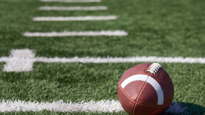 A football on a football field.