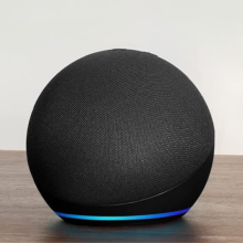 echo dot 5th gen sitting on a wooden table