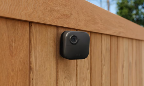 Blink outdoor camera on a wooden fence 